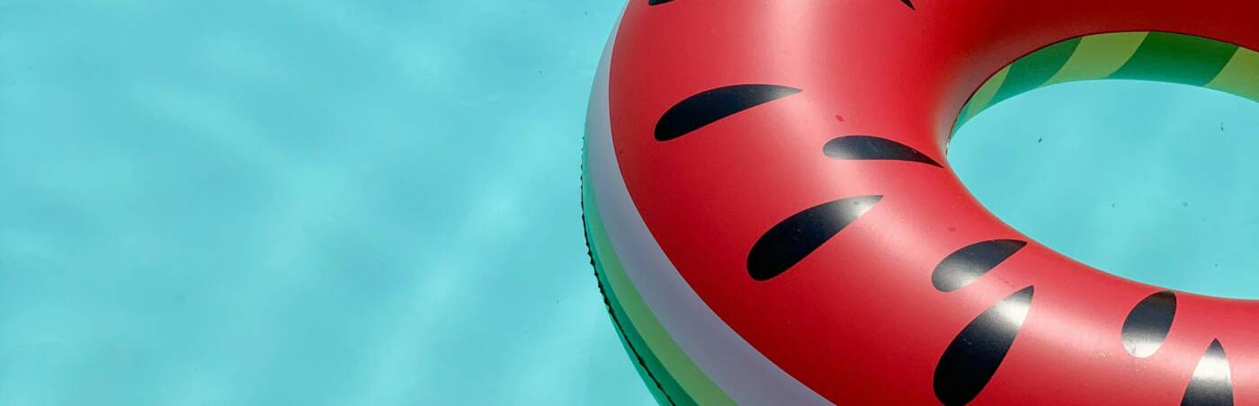 A colorful lifesaver floating on water.