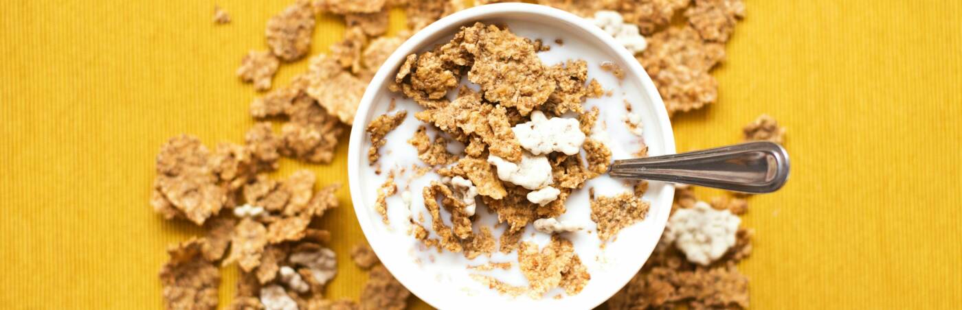 A bowl of cereal on a colorful background.